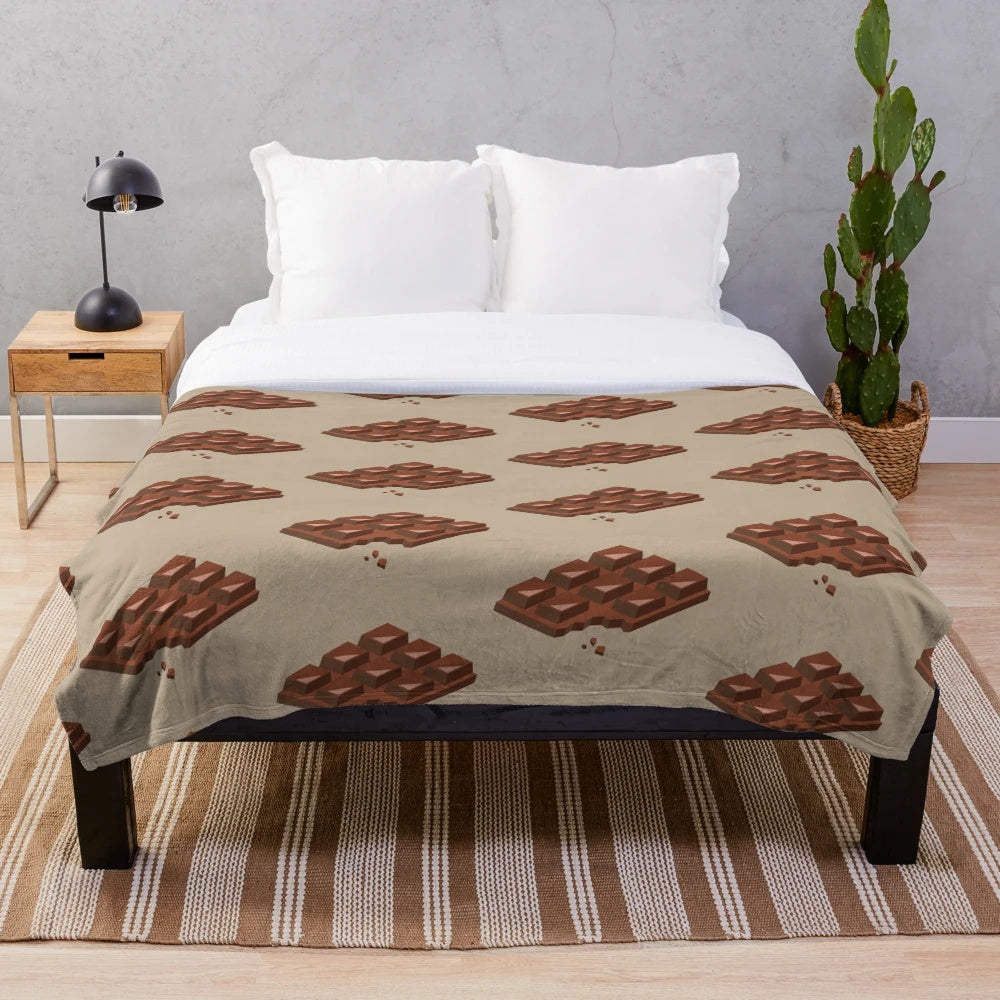 Chocolate-themed plush blanket with bitten chocolate design