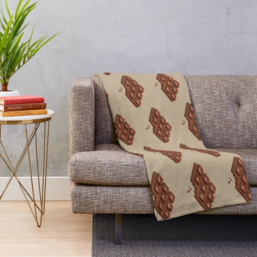 Chocolate-themed plush blanket with bitten chocolate design