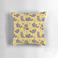 Illustration of a chubby, cute raccoon in a black, yellow, and gray pattern on a decorative pillow