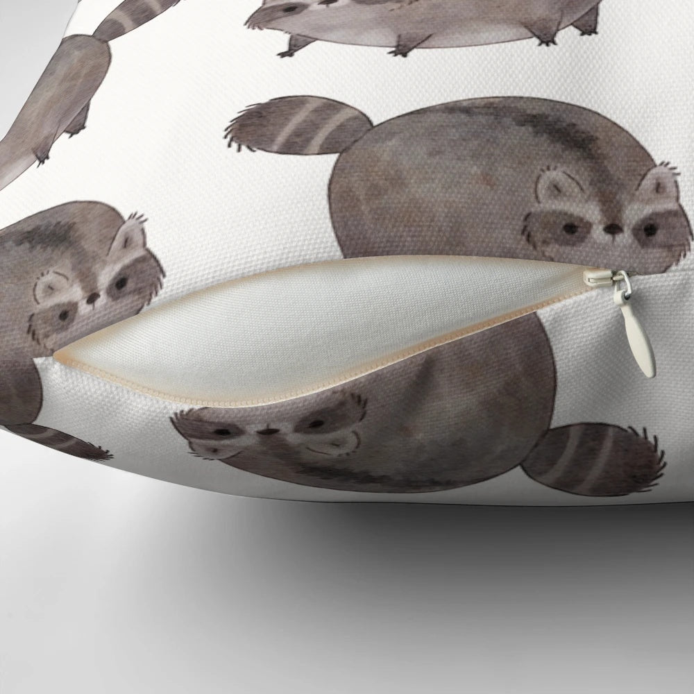 Plush pillow featuring an adorable chubby trash panda or raccoon design