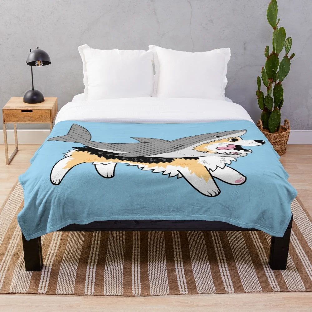 Corgi dog wearing a shark costume on a plush blanket