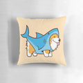 Cute corgi dog wearing a shark costume sitting on a decorative pillow