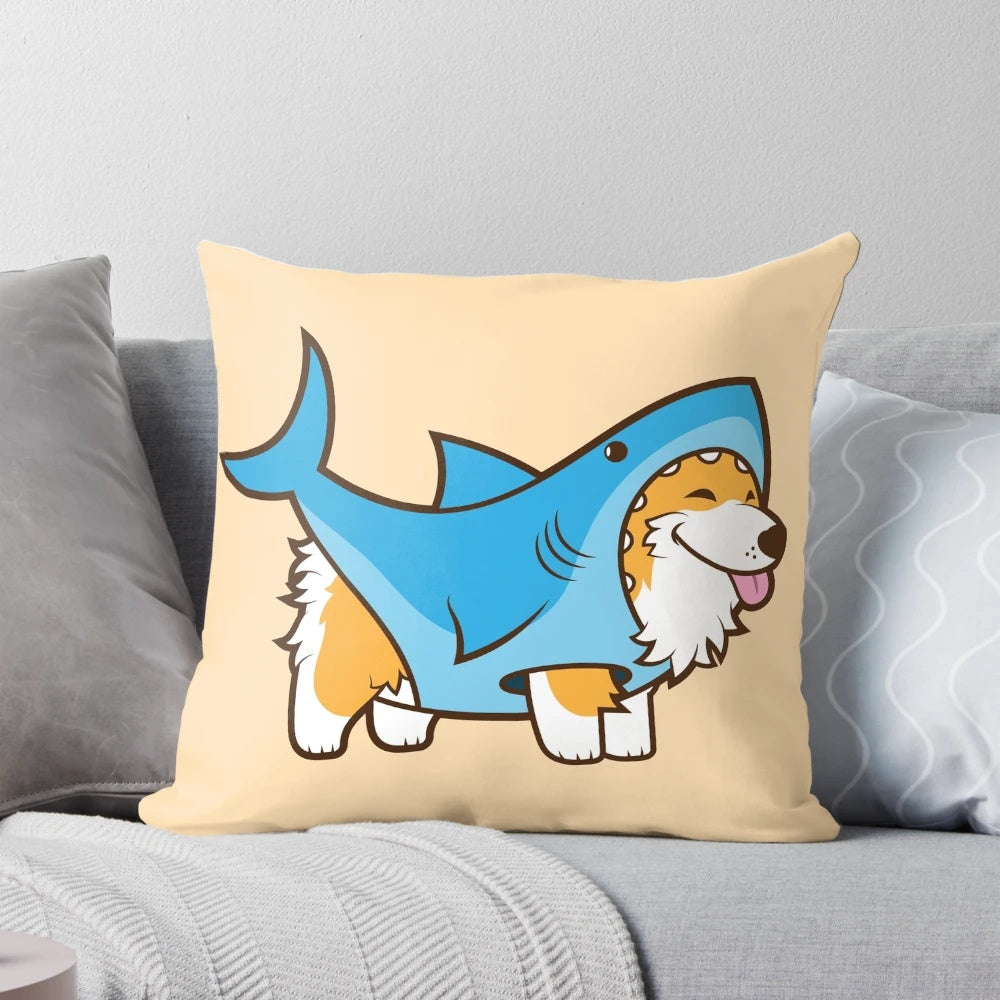 Cute corgi dog wearing a shark costume sitting on a decorative pillow