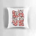 A cozy and cute cat-themed pillow, perfect for Valentine's Day gifts.