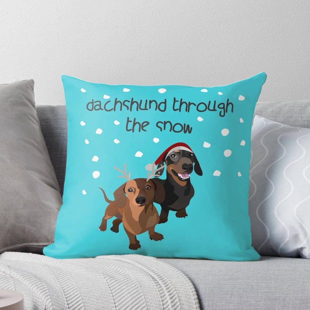 A cozy Christmas pillow featuring an adorable dachshund dog in the snow