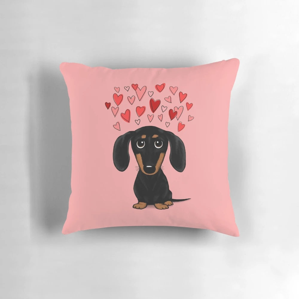 A Dachshund (wiener dog) pillow with Valentine's Day hearts in red and pink colors.