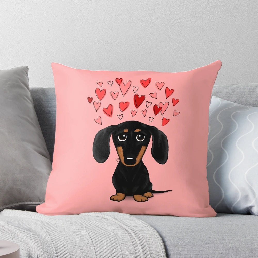 A Dachshund (wiener dog) pillow with Valentine's Day hearts in red and pink colors.