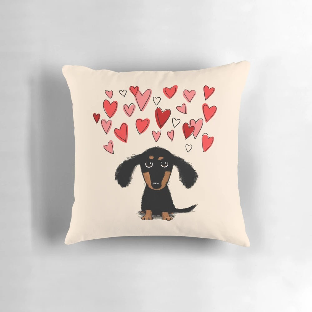 A cute dachshund puppy dog with pink and red heart designs on a throw pillow