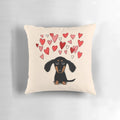 A cute dachshund puppy dog with pink and red heart designs on a throw pillow