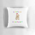 Dandie Dinmont Terrier wearing a festive Christmas hat printed on a plush, cozy pillow.