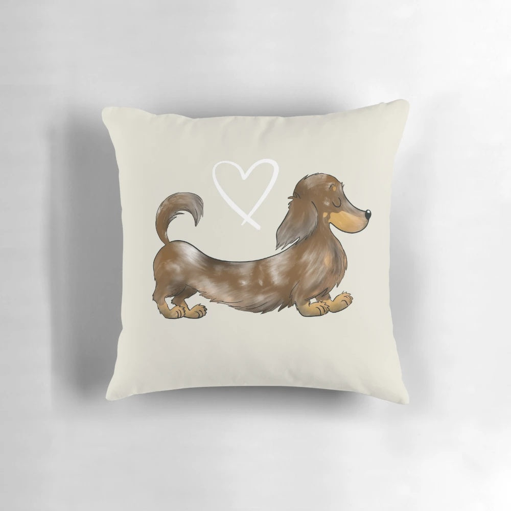 A soft, plush pillow featuring an illustration of a dapple chocolate long-haired dachshund dog.