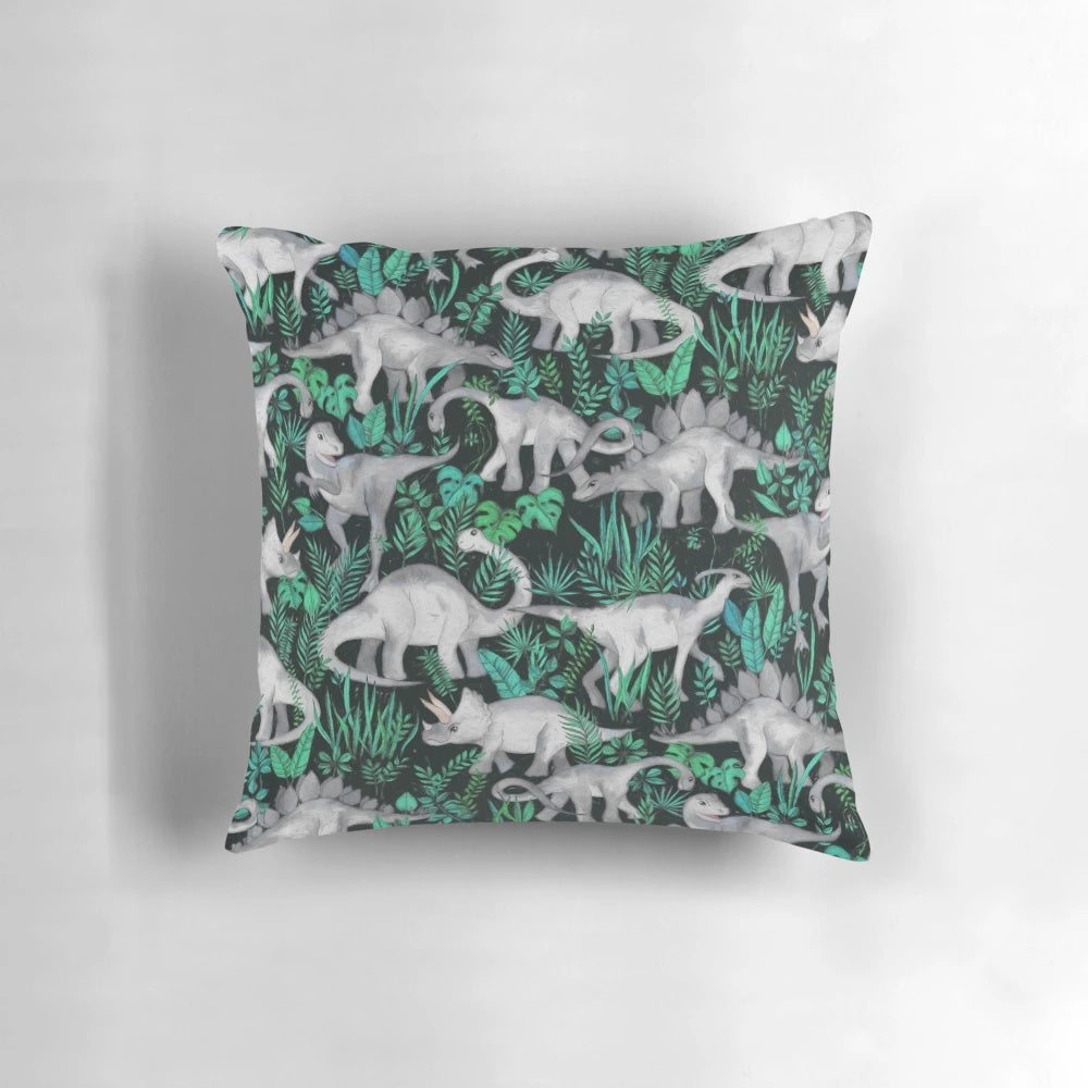 Plush dinosaur-themed pillow with vibrant tropical leaves and dinos