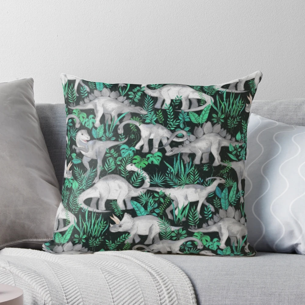 Plush dinosaur-themed pillow with vibrant tropical leaves and dinos