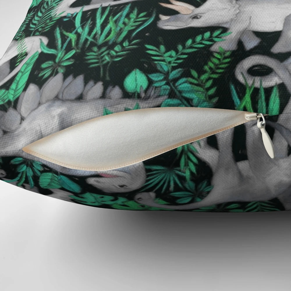 Plush dinosaur-themed pillow with vibrant tropical leaves and dinos