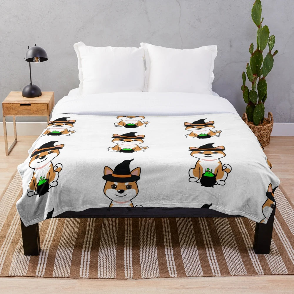 Cute dog wearing a witch costume on a plush blanket