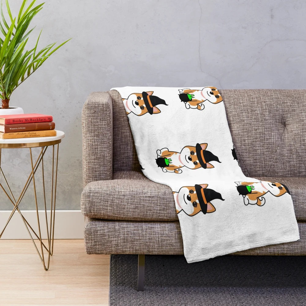 Cute dog wearing a witch costume on a plush blanket
