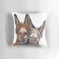 A soft, plush pillow featuring an adorable donkey with the "hee haw" expression.