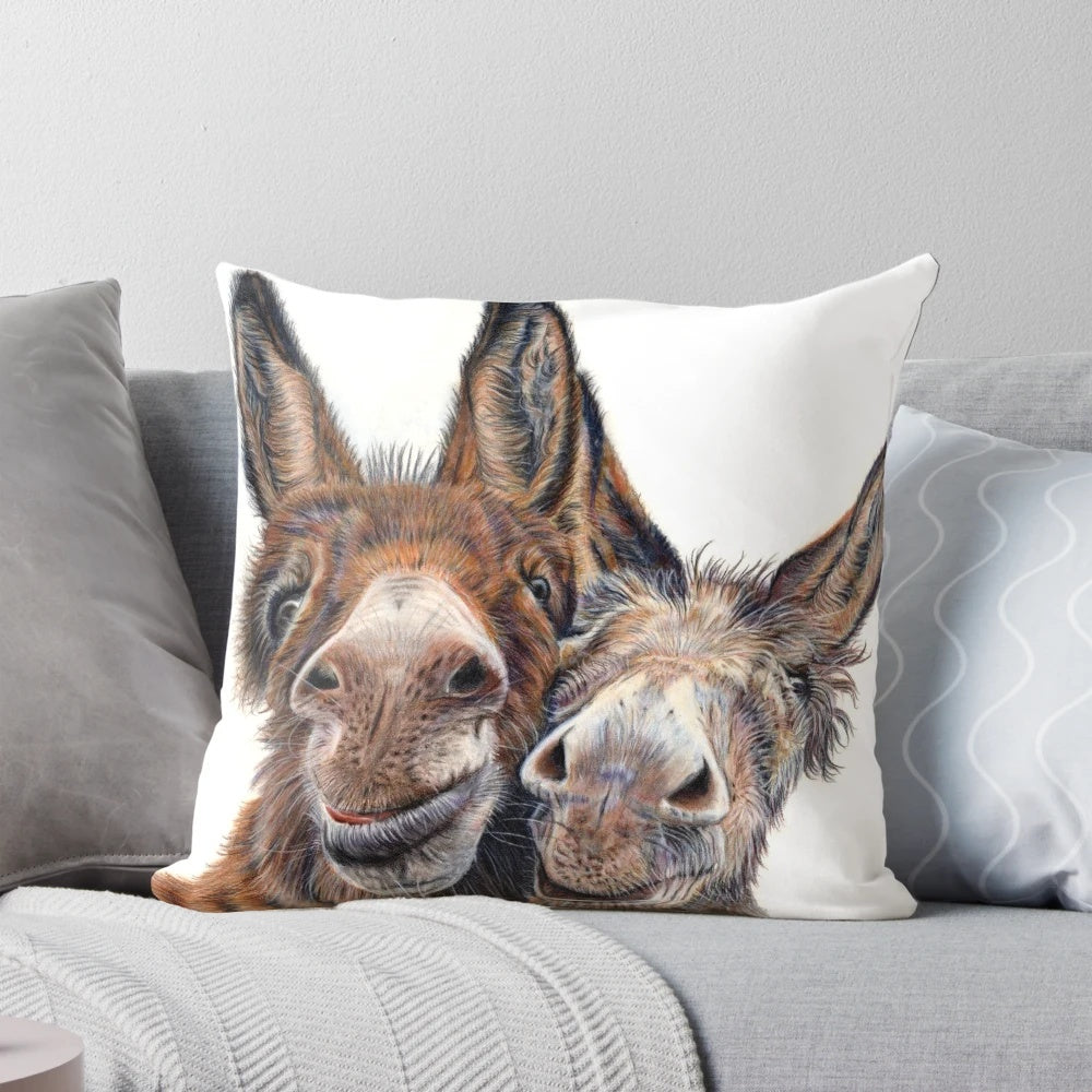 A soft, plush pillow featuring an adorable donkey with the "hee haw" expression.