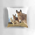 Cozy green pillow featuring a charming trio of donkey plush figures