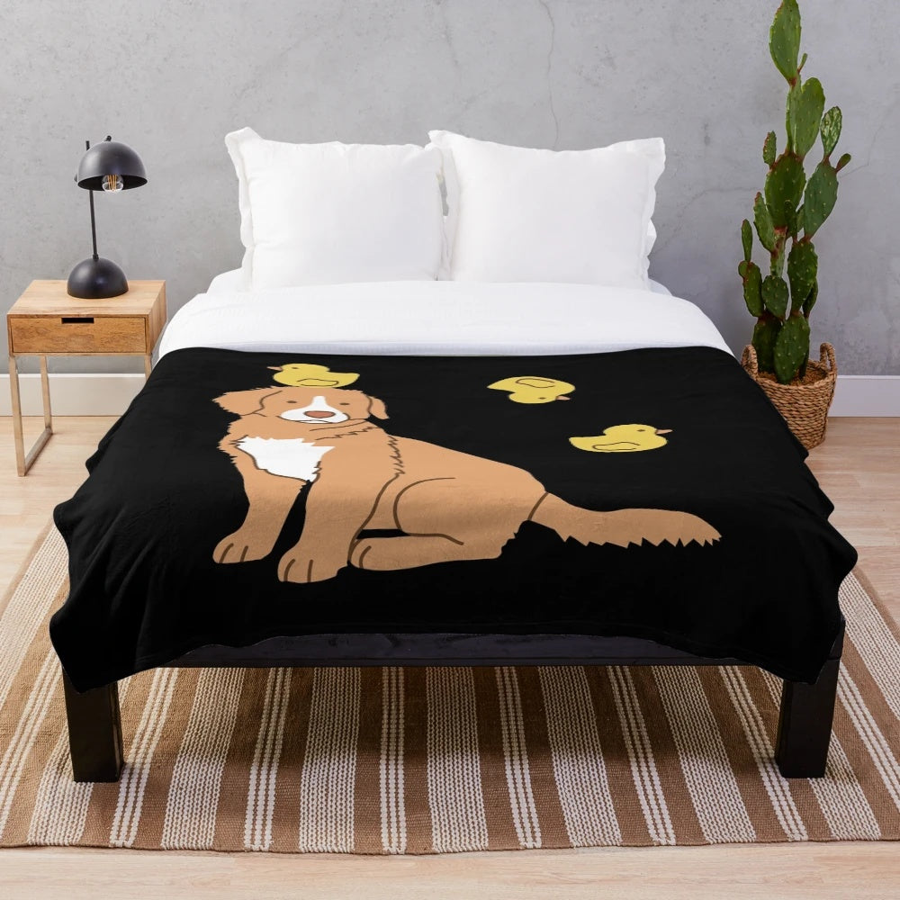 Plush blanket featuring a cute duck tolling retriever puppy and rubber ducks
