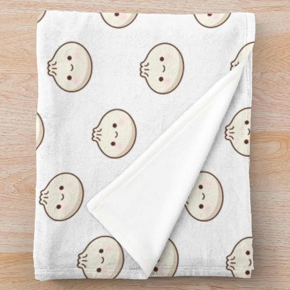 Soft and cuddly plush blanket featuring a cute dumpling design