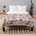 Floral pattern plush blanket featuring sausage dogs