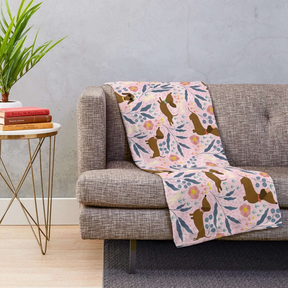 Floral pattern plush blanket featuring sausage dogs