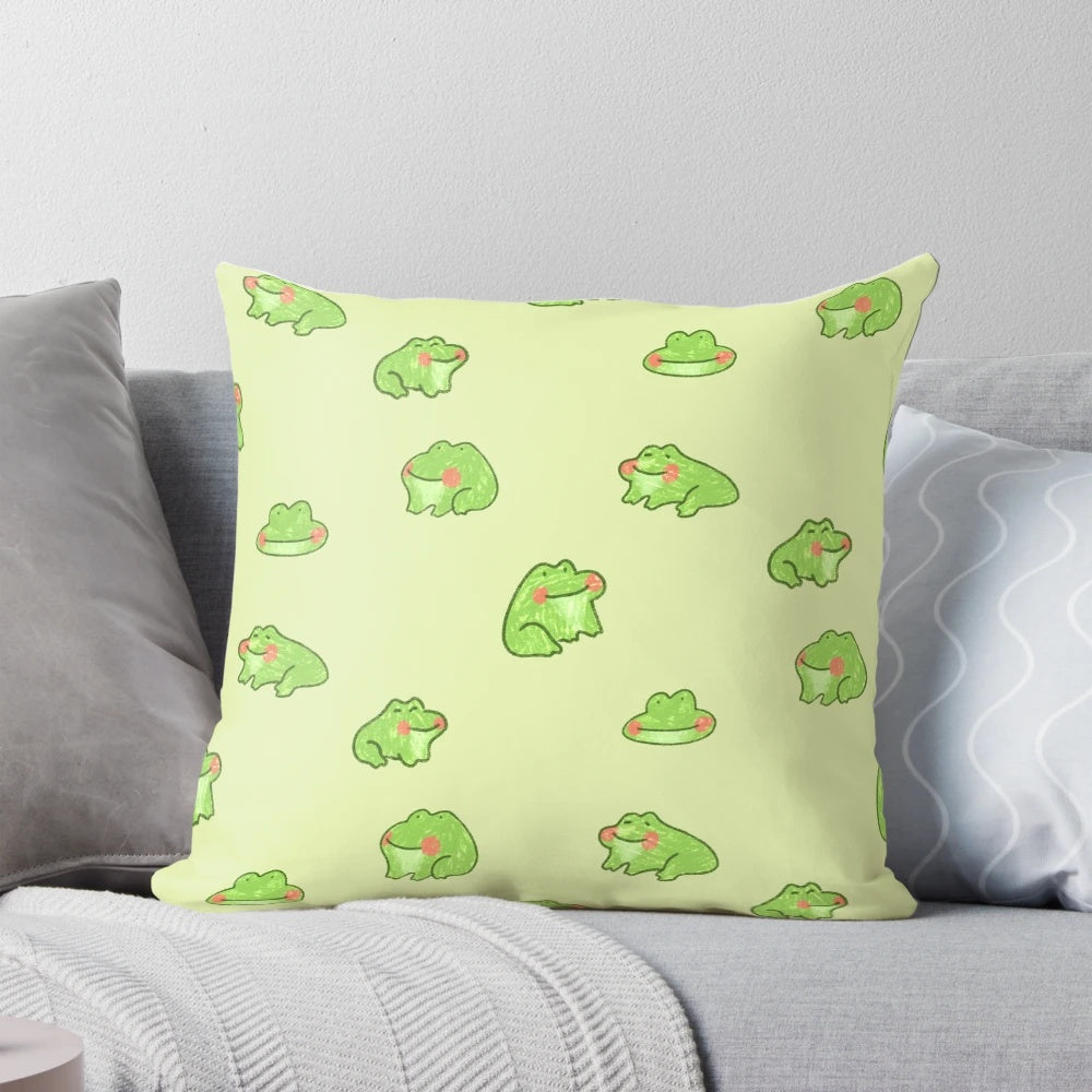 A soft, plush pillow featuring a playful design of two happy little frogs, perfect for adding a touch of whimsy to any space.