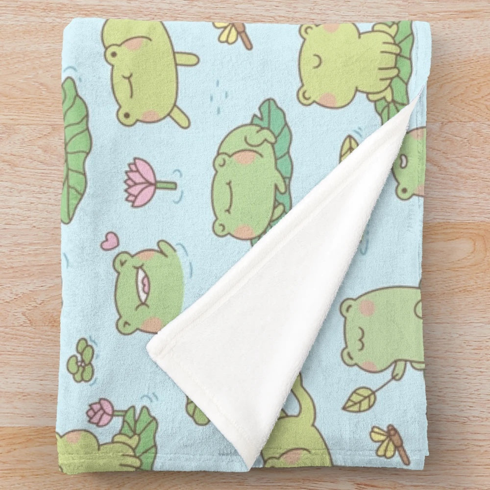 Soft and cozy plush blanket featuring a cute frog and dragonfly pond pattern design