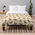 Adorable German Shepherd puppy on a plush blanket with a cute cartoon pattern