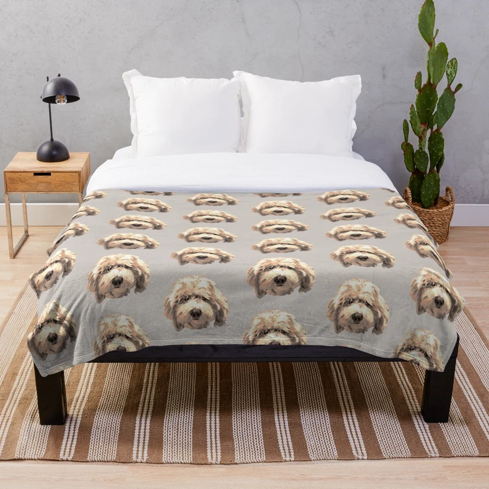 Soft and cuddly golden labradoodle face on a plush blanket