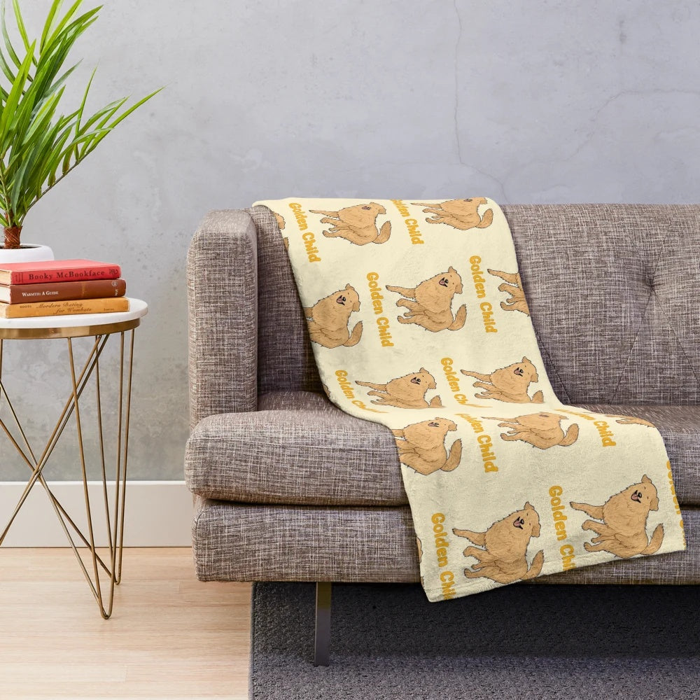 Golden retriever puppy snuggling on a soft plush blanket