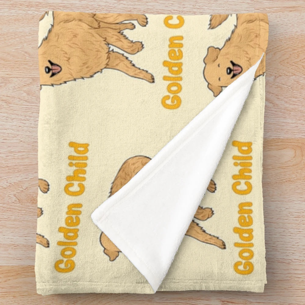Golden retriever puppy snuggling on a soft plush blanket