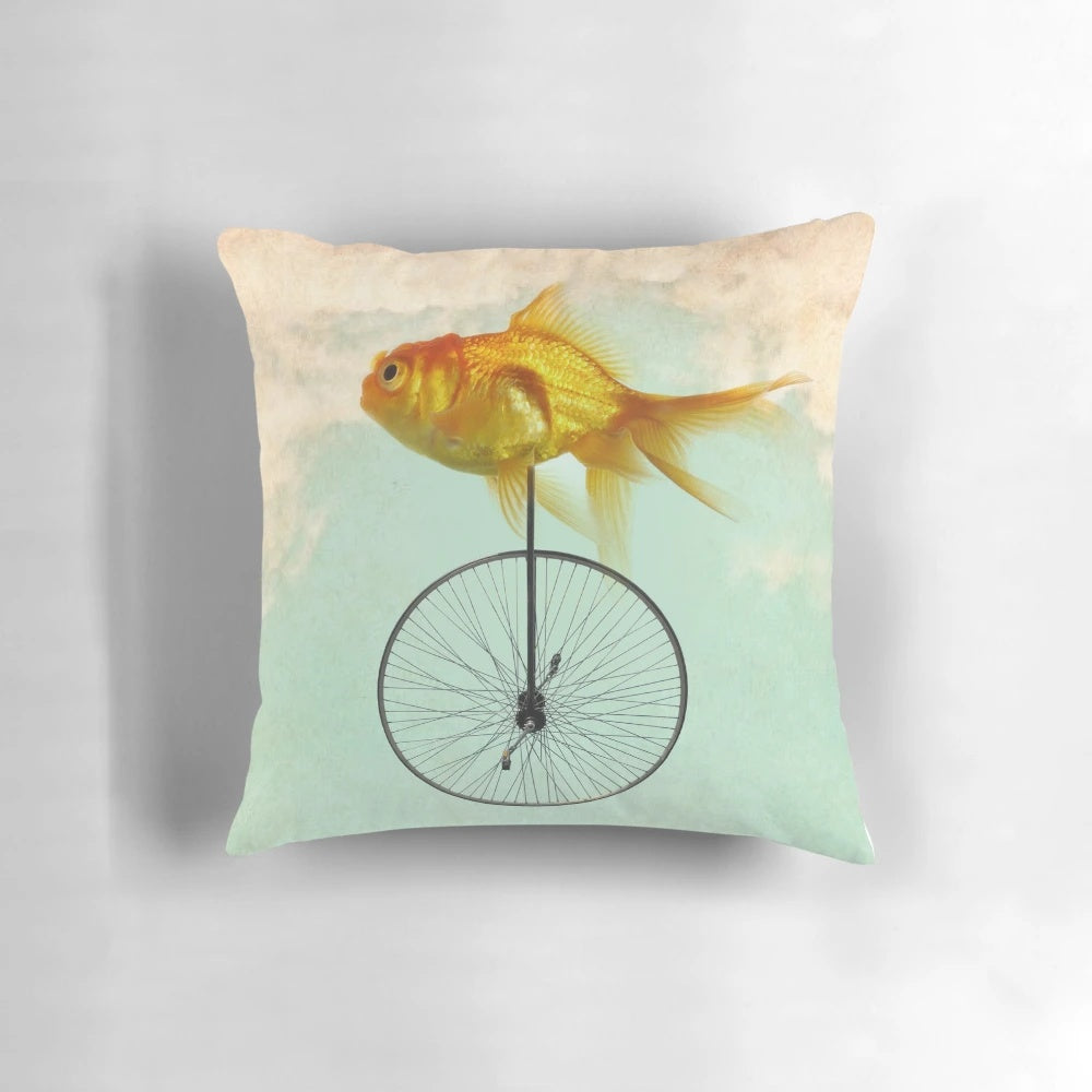 Goldfish riding a unicycle, an endearing and appealing decorative pillow design