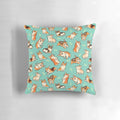 Decorative throw pillow featuring a pattern of cute, playful corgis in a green background.