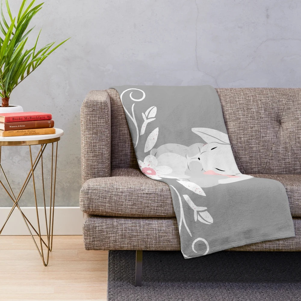 Soft and cozy grey and white bunny rabbit plush blanket with white floral design