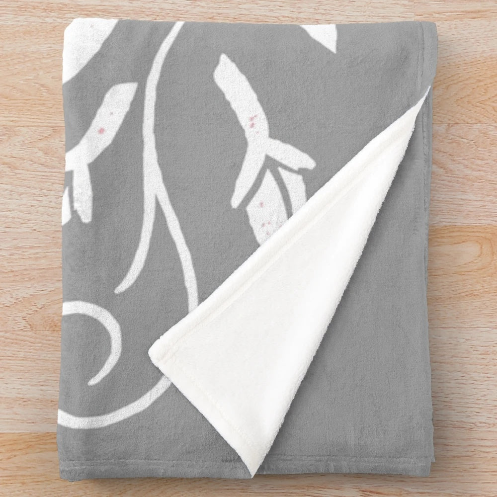 Soft and cozy grey and white bunny rabbit plush blanket with white floral design