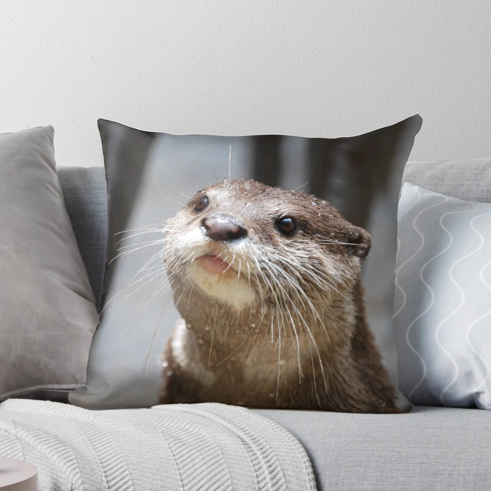 Soft and cuddly grey otter throw pillow with whiskers and cute facial expression