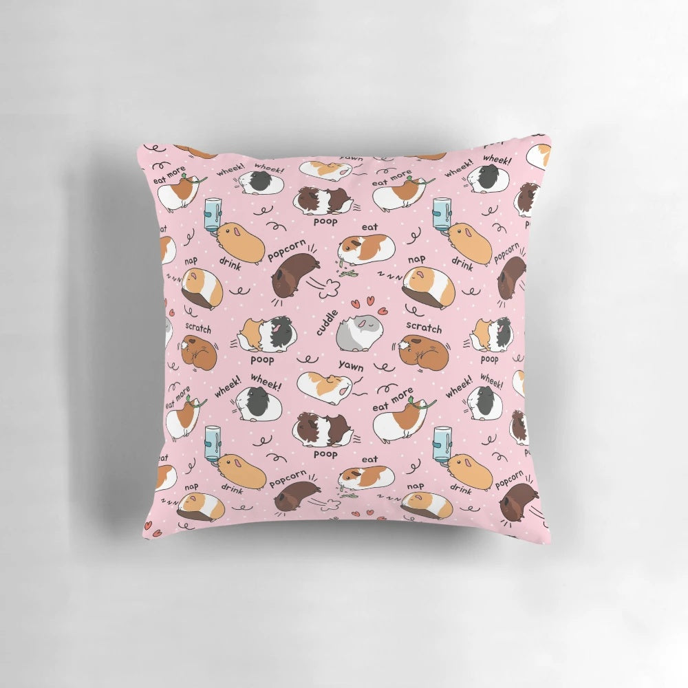 Soft pink pillow with a cute guinea pig and its daily routine printed on it.