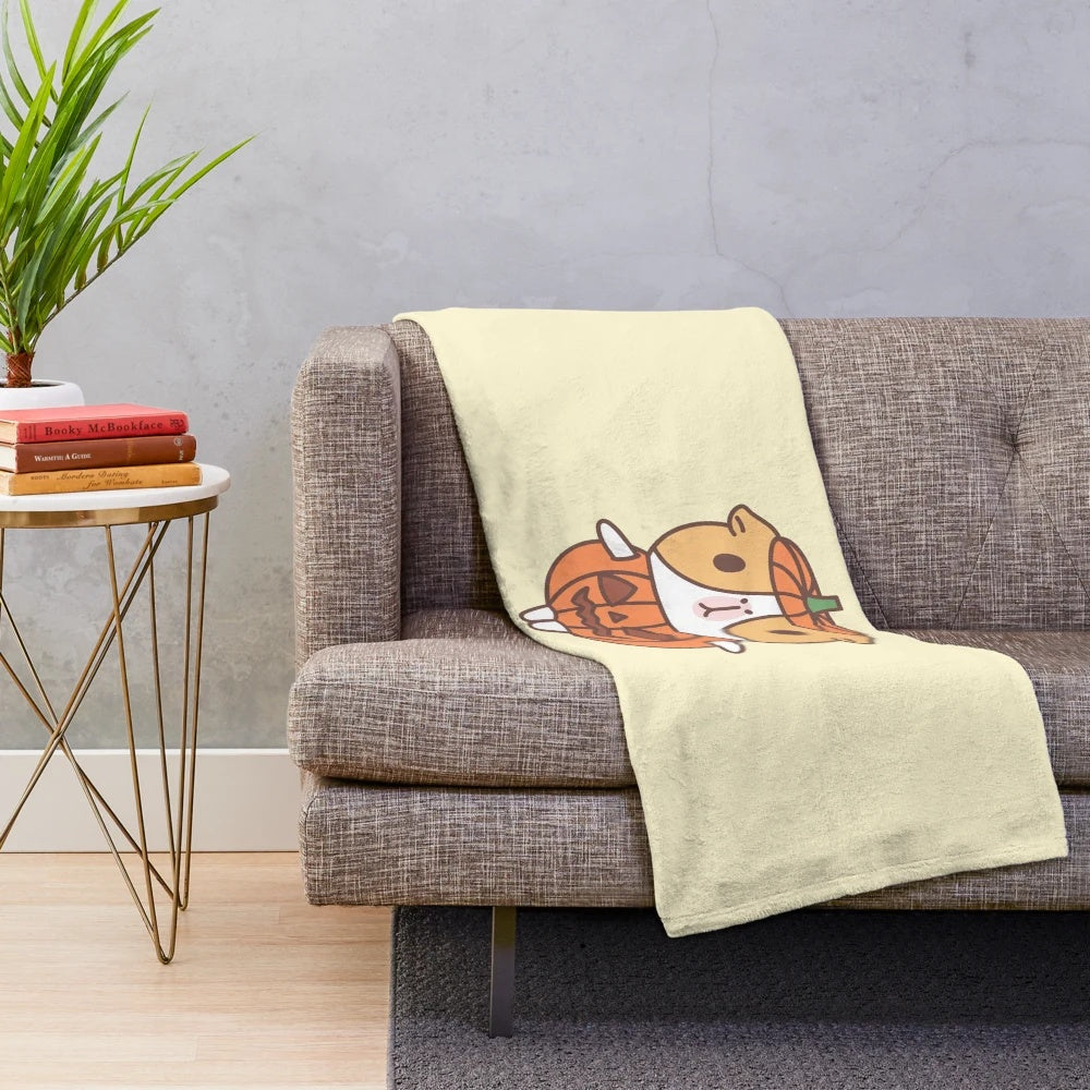 Cute guinea pig wearing an orange pumpkin costume