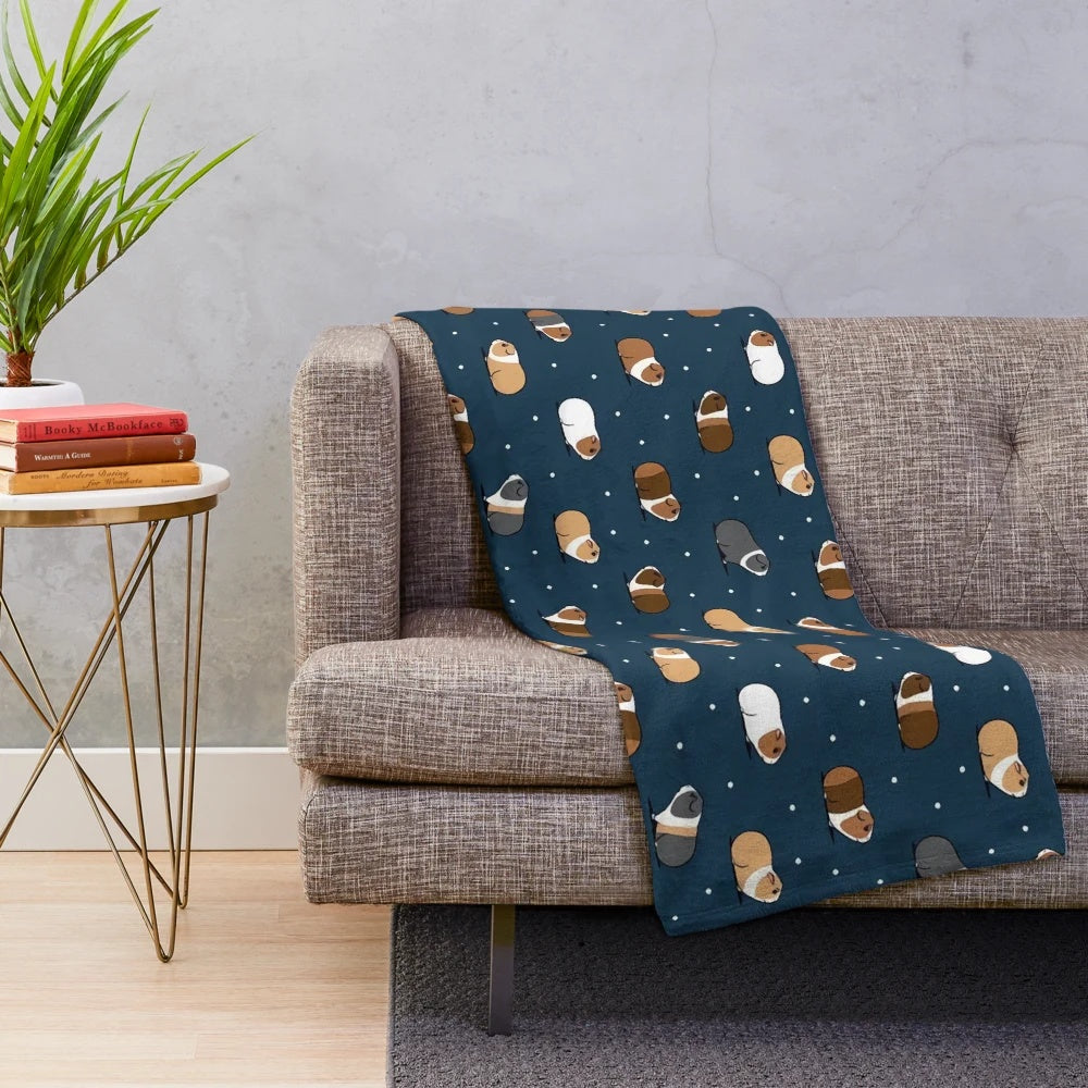 Cute guinea pig design on a navy blue plush blanket