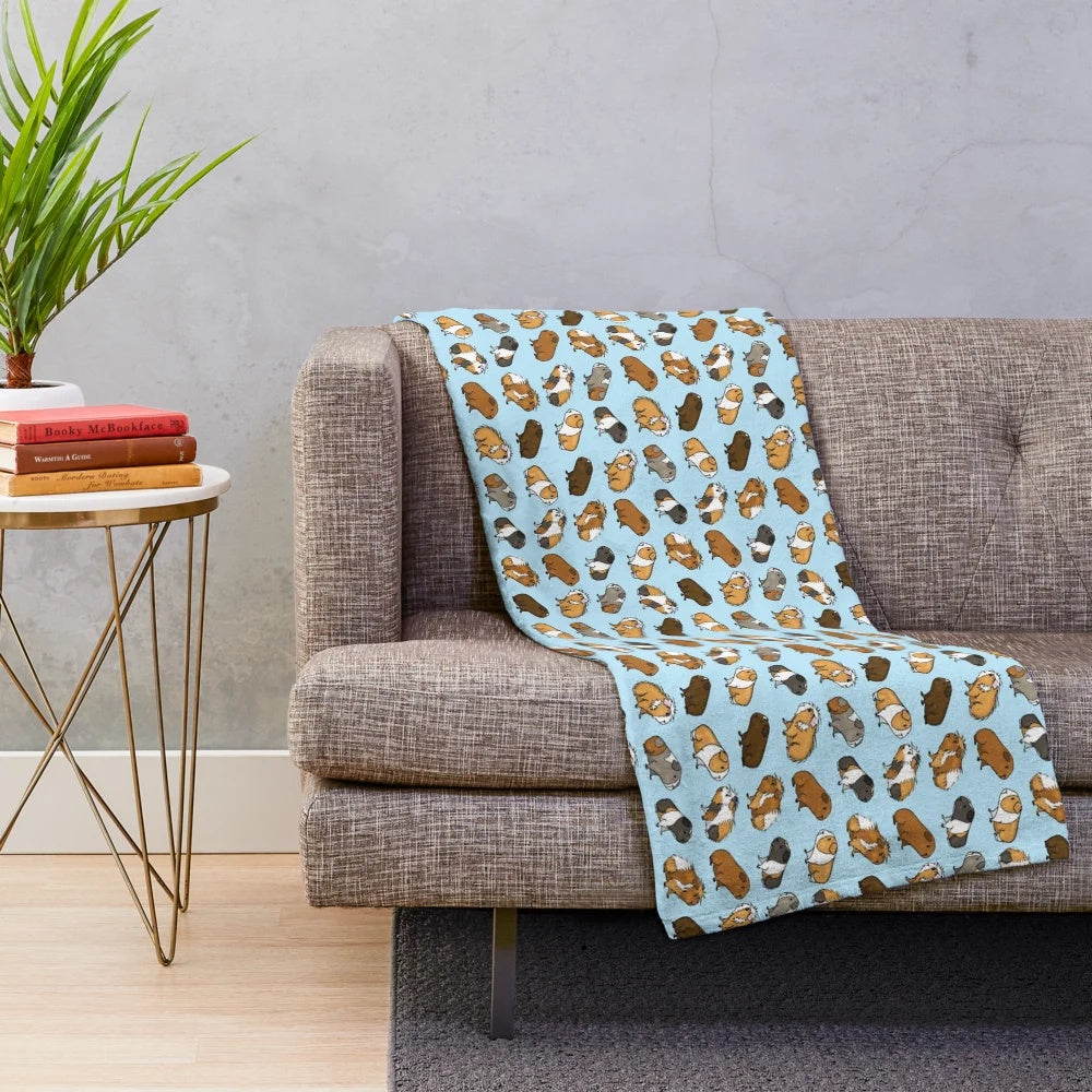 Soft and cuddly plush blanket featuring an adorable guinea pig repeat pattern design
