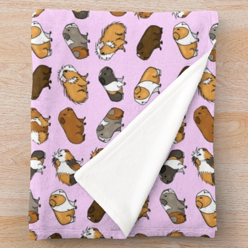 Soft and cuddly guinea pig plush blanket with a repeating pattern design