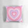 Soft, heart-shaped decorative pillow in pastel colors