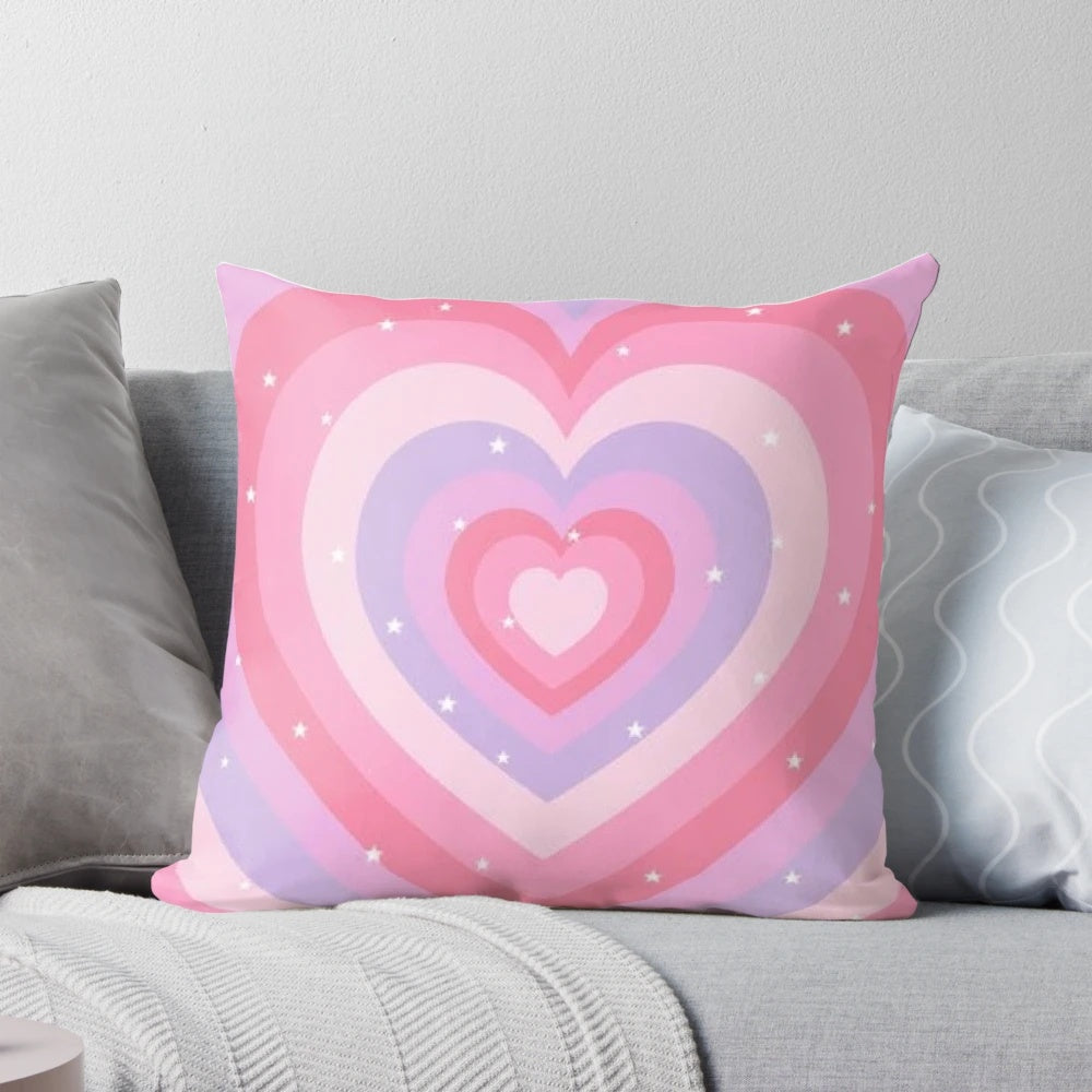Soft, heart-shaped decorative pillow in pastel colors