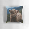Soft and fluffy highland cow calf pillow, perfect for snuggling and decorating