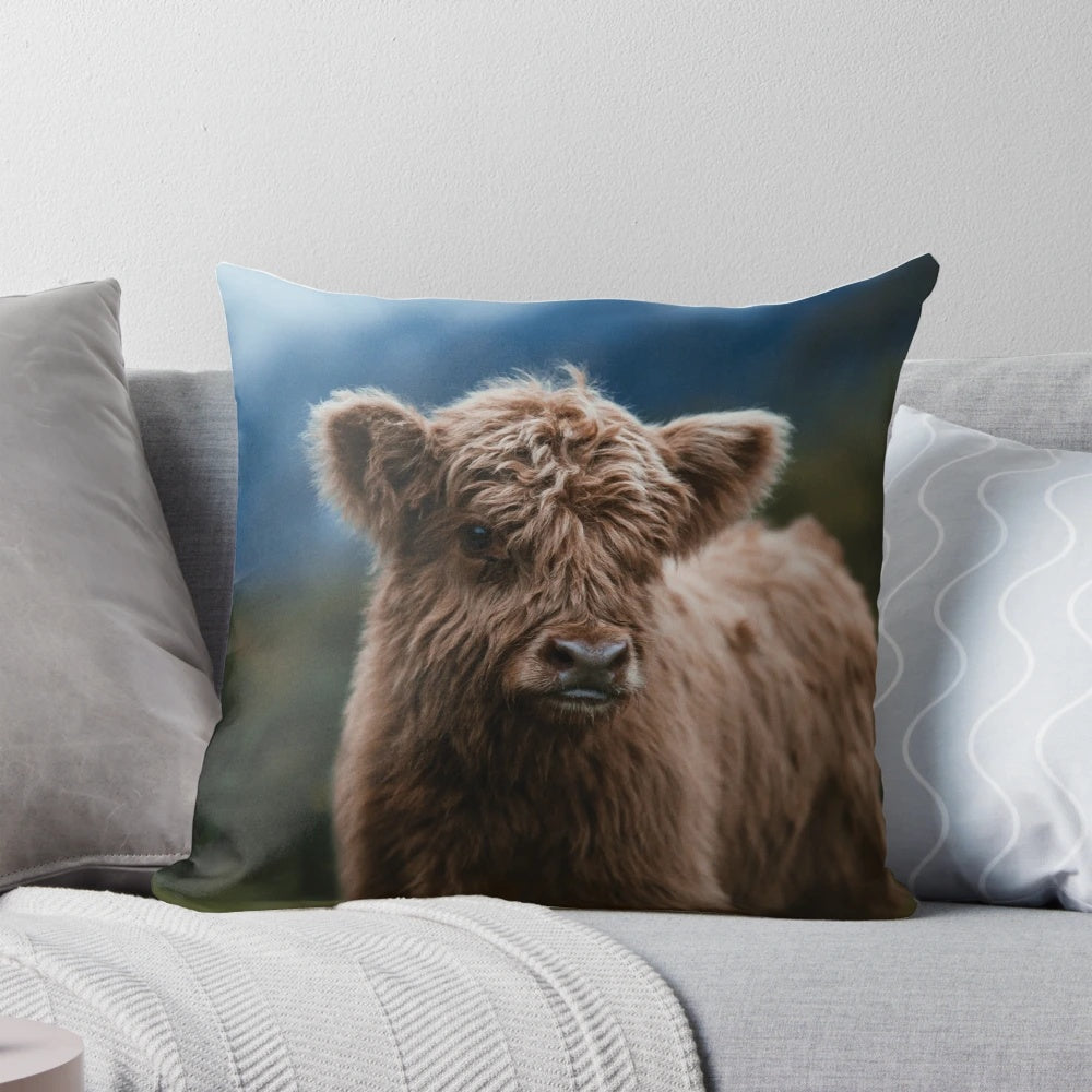 Soft and fluffy highland cow calf pillow, perfect for snuggling and decorating