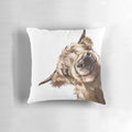 Soft, plush pillow featuring a playful highland cow with a big nose