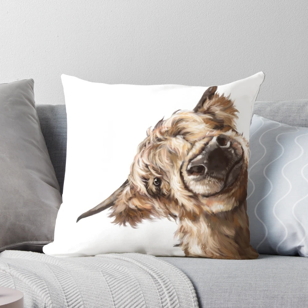 Soft, plush pillow featuring a playful highland cow with a big nose