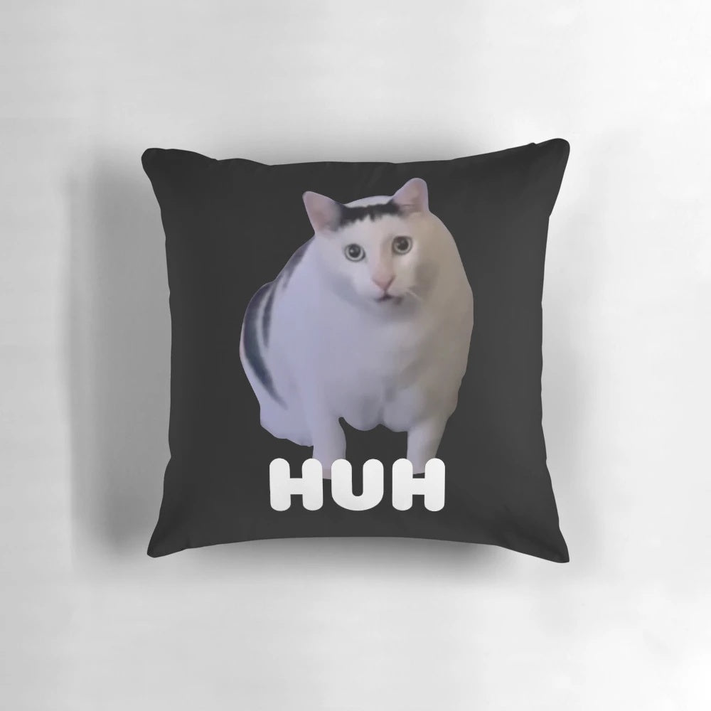 Huh?" cat meme printed on a soft, plush throw pillow for a touch of whimsical cat humor in your home.
